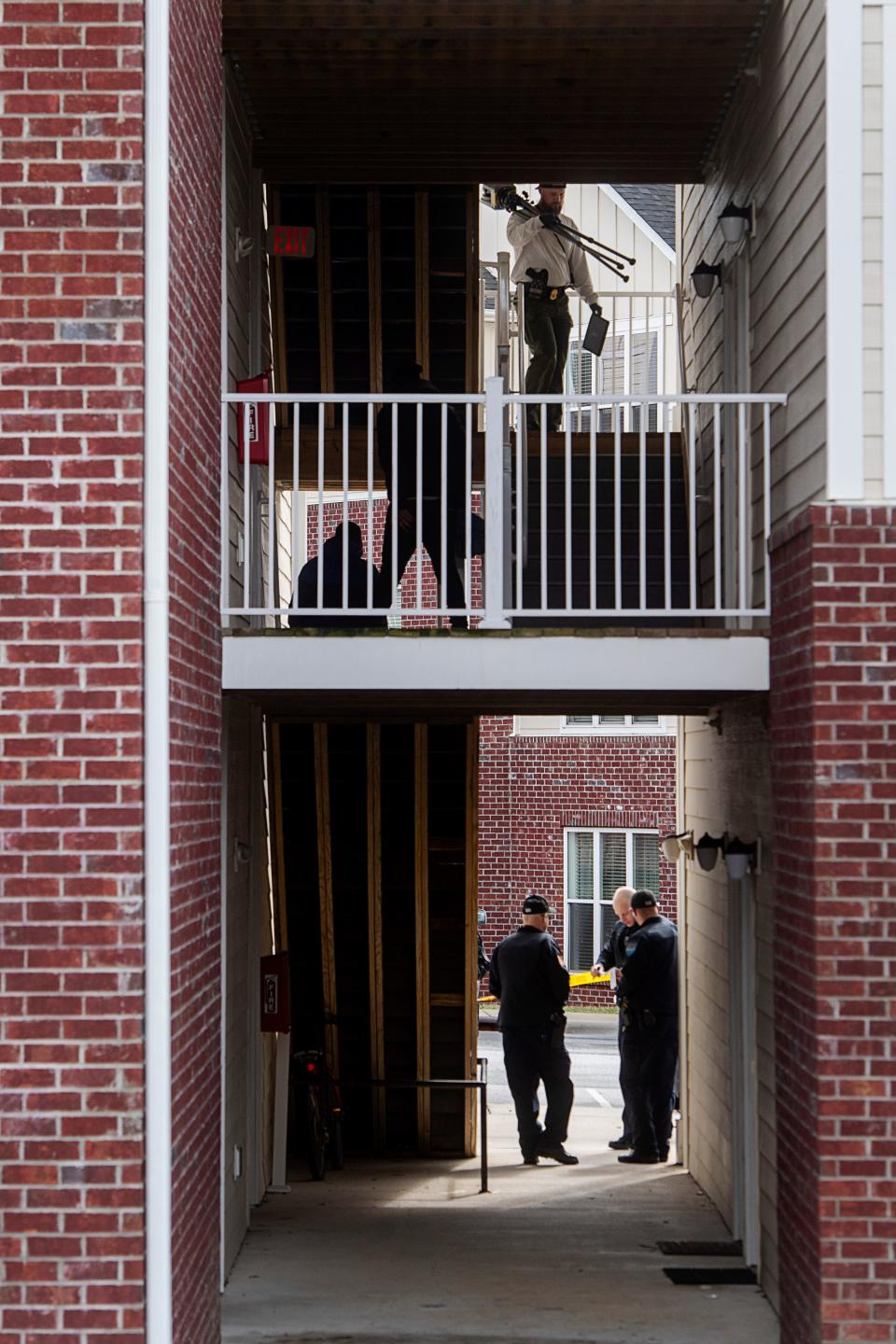 Police investigate the scene at Brittany Place Apartment Homes in Hendersonville, February 23, 2024, after an off-duty Henderson County Sheriff’s deputy shot a 25-year-old man with his personal firearm.