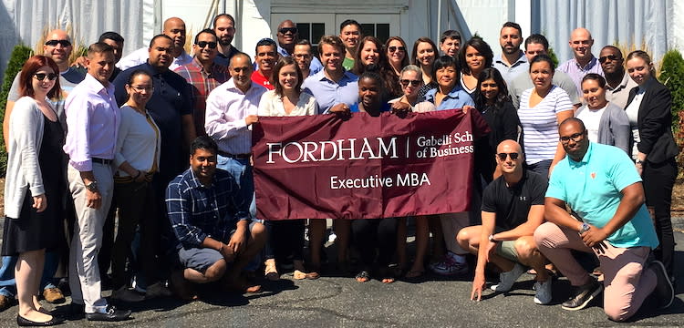 A recent graduating class of EMBA students from Fordham University's Gabelli School of Business