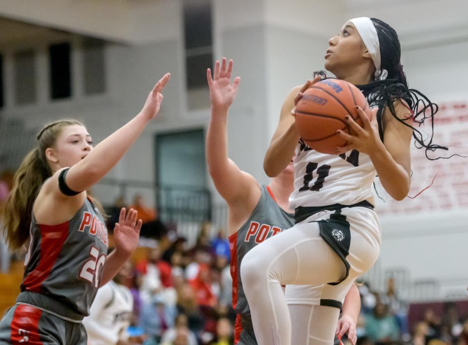 Peoria High's Aaliyah Guyton moves to the basket against Morton in the first half of their girls basketball game Tuesday, Nov. 14, 2023 at Peoria High School. The Lions defeated the Potters 53-48.