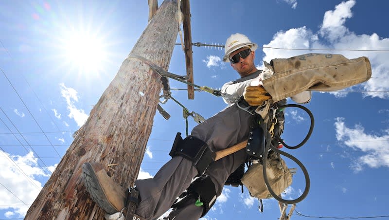 Apprentice lineman Braden Grover works with other students in his class as they work on line at the Salt Lake training facility of Rocky Mountain Power on Monday, April 29, 2024.