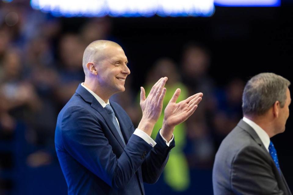 Kentucky athletic director Mitch Barnhart introduces new men’s basketball coach Mark Pope to a capacity crowd at Rupp Arena on Sunday.