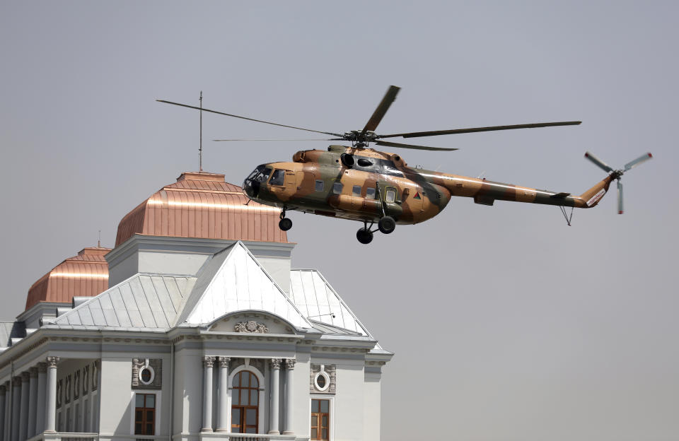 A helicopter carrying President Ashraf Ghani lands at the Darul Aman Palace in Kabul, Afghanistan, Monday, Aug. 2, 2021. (AP Photo/Rahmat Gul)