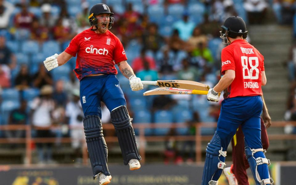 Phil Salt and Harry Brook celebrate a stunning win for England in Grenada