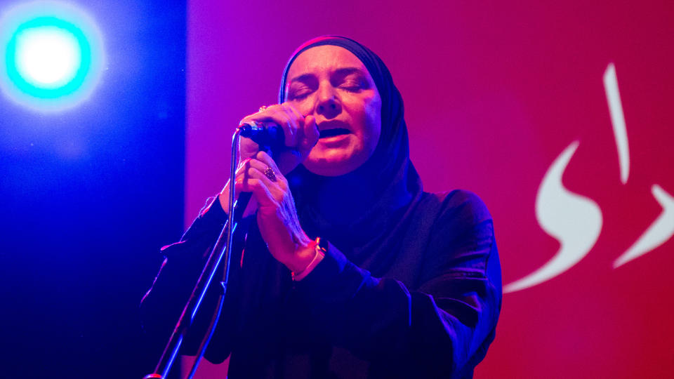Sinéad O'Connor singing on stage