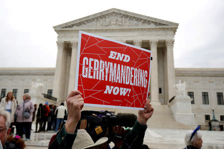 FILE PHOTO: Demonstrators rally in front of the Supreme court before oral arguments on Benisek v. Lamone, a redistricting case on whether Democratic lawmakers in Maryland unlawfully drew a congressional district in a way that would prevent a Republican candidate from winning, in Washington, U.S., March 28, 2018. REUTERS/Joshua Roberts/File Photo