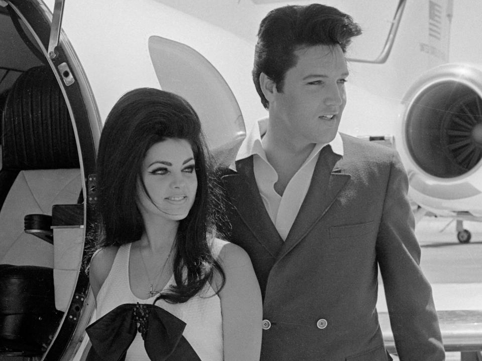 Newlyweds Elvis and Priscilla Presley, who met while Elvis was in the Army, prepare to board their private jet following their wedding at the Aladdin Resort and Casino in Las Vegas.