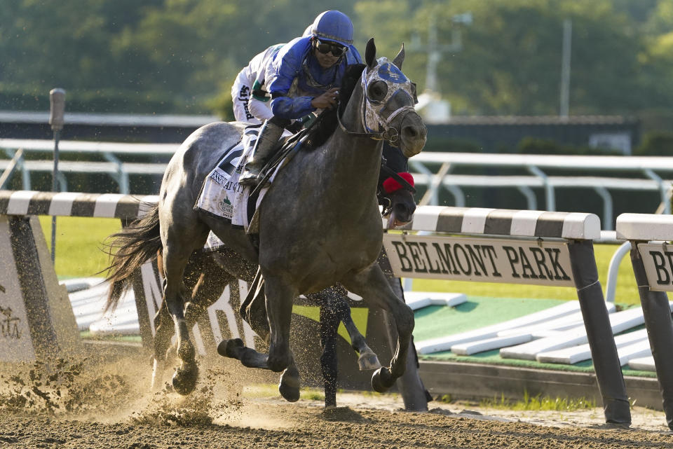 Essential Quality (2), with jockey Luis Saez up, crosses the finish line to win the 153rd running of the Belmont Stakes horse race, Saturday, June 5, 2021, At Belmont Park in Elmont, N.Y. (AP Photo/John Minchillo)