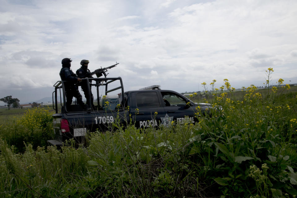 Mexican federal police guard near the Altiplano maximum security prison in Almoloya, west of Mexico City, Sunday, July 12, 2015.  (AP Photo/Marco Ugarte)