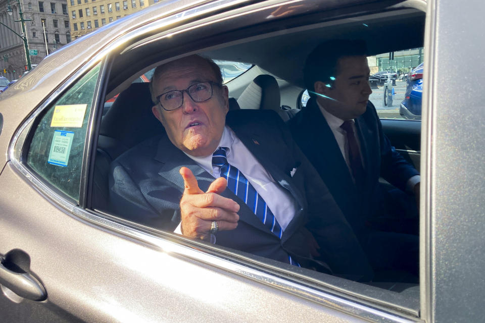 Former New York City mayor Rudy Giuliani speaks to reporters after a court hearing, Monday, Dec. 12, 2022, in New York. Rudy Giuliani beat a contempt order and avoided jail Monday in an ongoing dispute over money he owes to his ex-wife, Judith Giuliani, as part of their 2019 divorce settlement. (AP Photo/Michael Sisak)