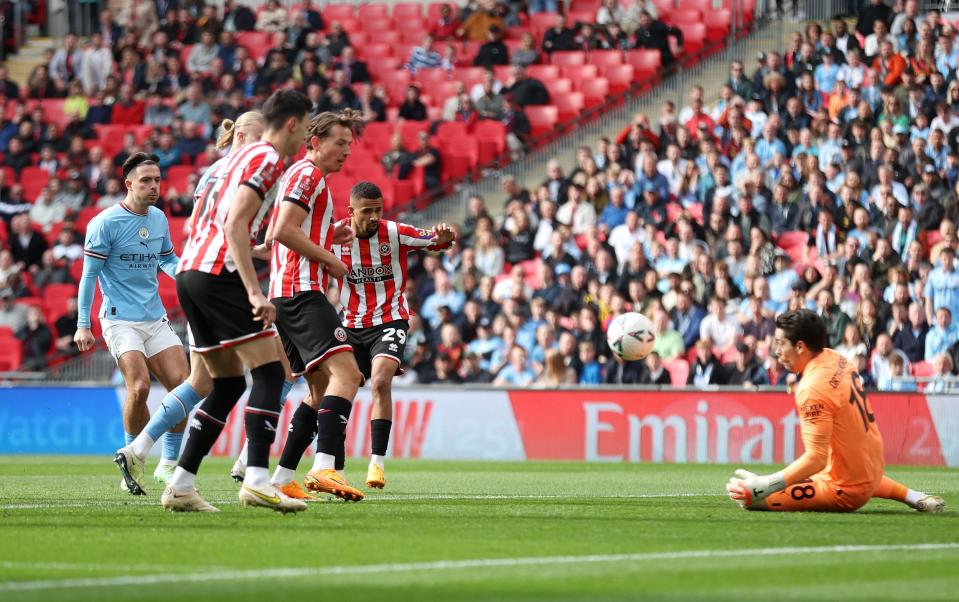 Iliman Ndiaye of Sheffield United shoots at Stefan Ortega of Manchester City - Alex Pantling/The FA via Getty Images