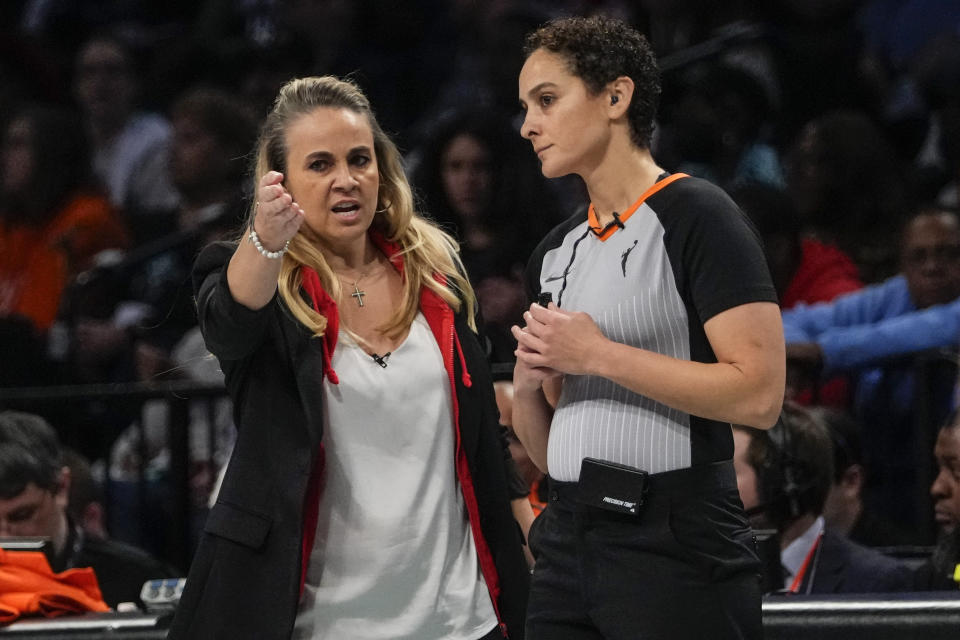 ADDS NAME OF OFFICIAL - Las Vegas Aces head coach Becky Hammon, left, talks with official Tiara Cruse during the second half in Game 4 of a WNBA basketball final playoff series against the New York Liberty, Wednesday, Oct. 18, 2023, in New York. The Aces won 70-69. (AP Photo/Frank Franklin II)