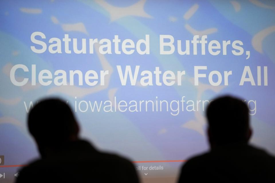 Audience members listen to a presentation during an edge-of-field workshop at the Ames Water Treatment Plant, Thursday, March 2, 2023, in Ames, Iowa. Simple systems called bioreactors and streamside buffers help filter nitrates from rainwater before it can reach streams and rivers. (AP Photo/Charlie Neibergall)