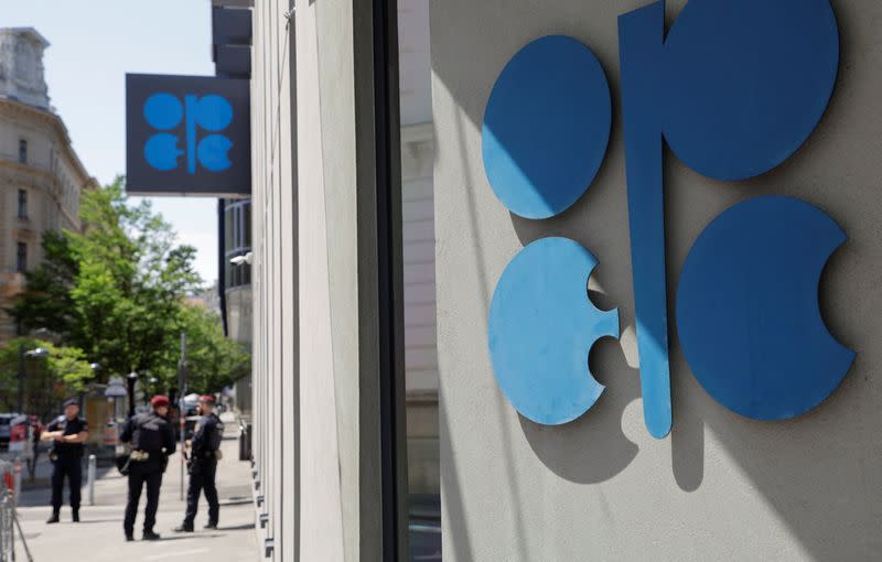 Austrian police officers stand in front of the OPEC headquarters in Vienna