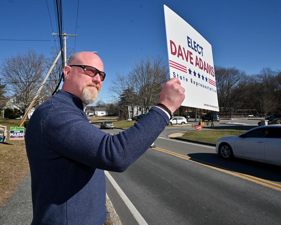 Dave Adams looks for votes at Dudley Town Hall Tuesday.