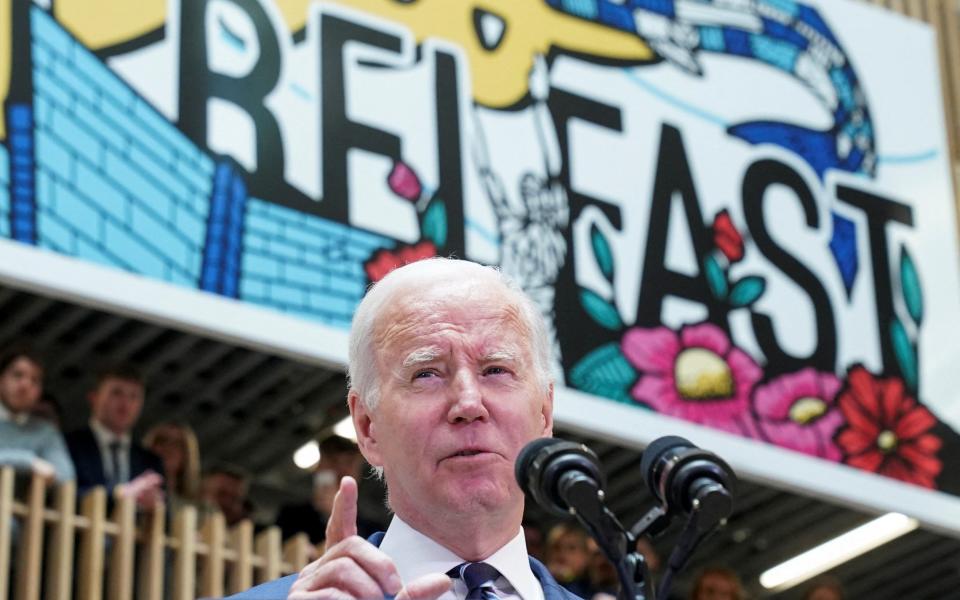 Joe Biden, the US President, is pictured delivering a speech at Ulster University in Belfast this afternoon - Kevin Lamarque /Reuters 