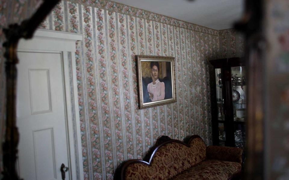 A portrait of Lizzie Borden hangs on a wall at the Lizzie Borden house in Fall River, which is now a bed and breakfast.