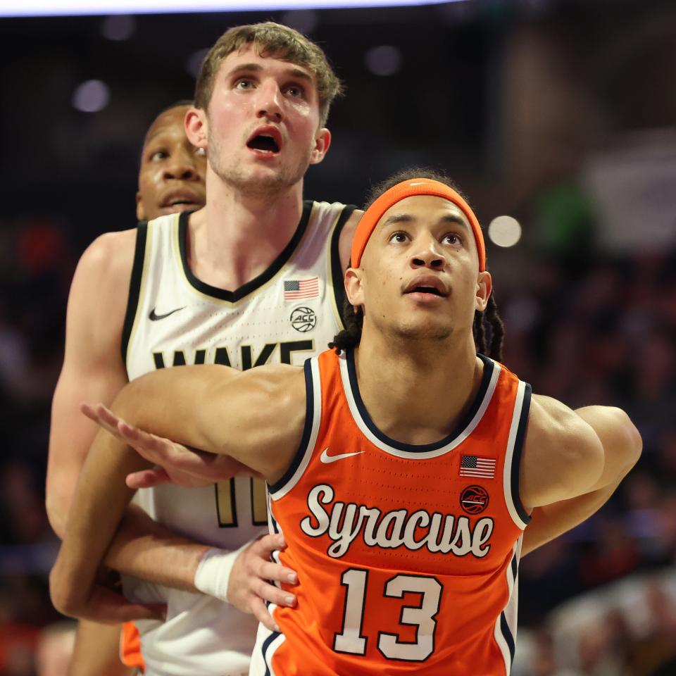 Benny Williams of the Syracuse Orange boxes out Andrew Carr of the Wake Forest Demon Deacons at the free throw line during the second half at Lawrence Joel Veterans Memorial Coliseum on February 3.