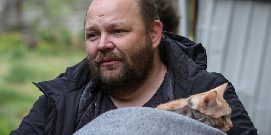 A resident of a five-story building in Dnipro saves his cats after Russian missile strike