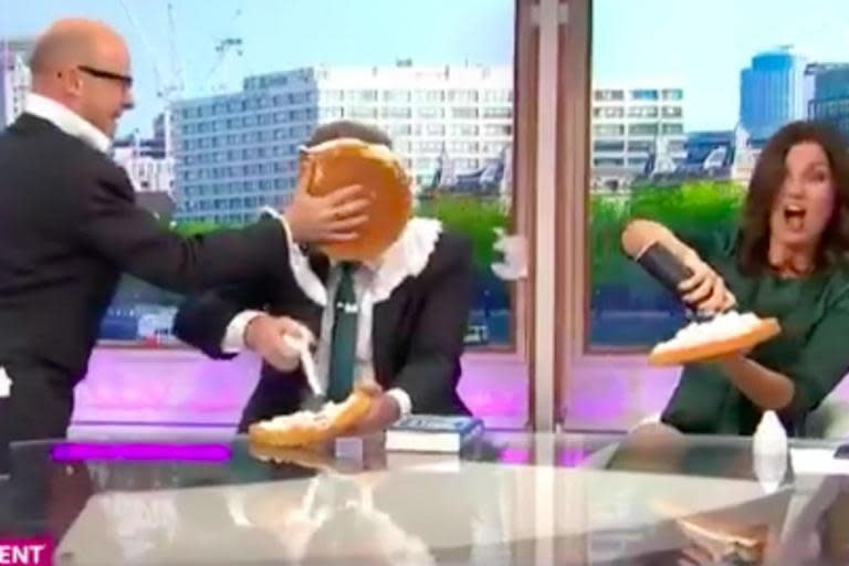 Harry Hill throws cream pie in Piers Morgan's face after papoose remarks: 'This is for Daniel Craig'