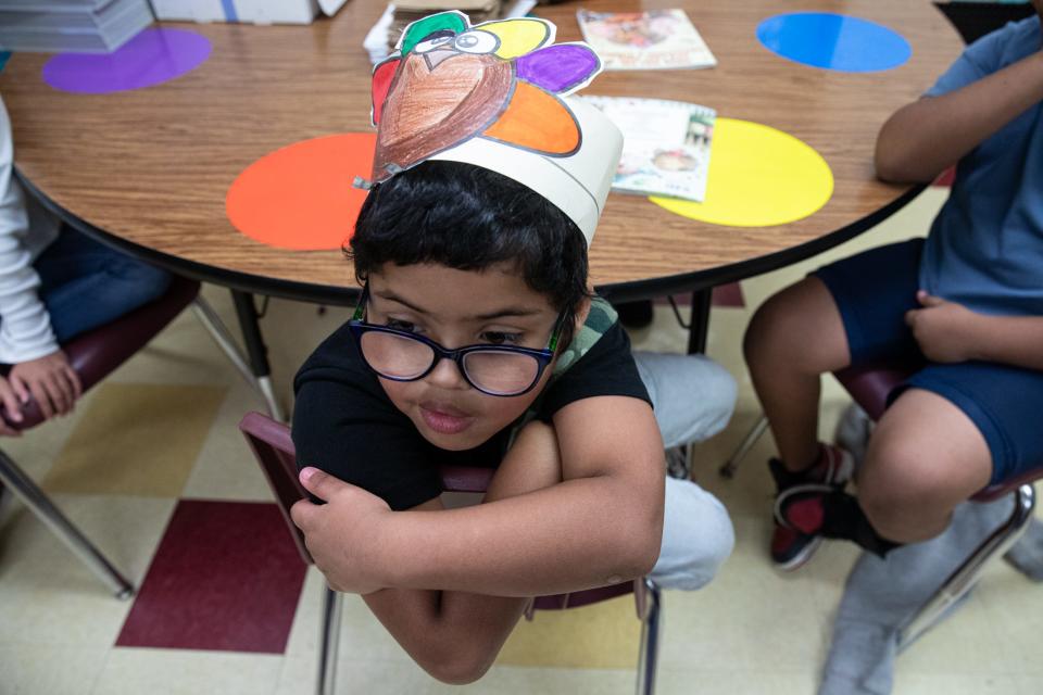 Third grade student Brandon Macias listens to teachers read "There Was an Old Lady Who Swallowed a Turkey" by Lucille Colandro at Sam Houston Elementary on Thursday, Nov. 16, 2023, in Corpus Christi, Texas.