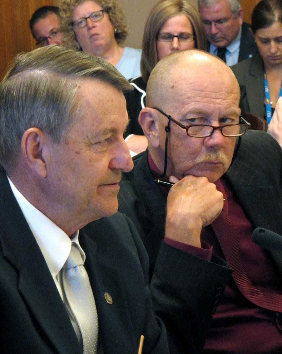 Kansas state Reps. Richard Carlson, left, a St. Marys Republican, and Nile Dillmore, right, a Wichita Democrat, participate in negotiations with the Senate over proposed tax cuts, Tuesday May 15, 2012, at the Statehouse in Topeka, Kan. The House and Senate have resumed their talks over proposed reductions.(AP Photo/John Hanna)