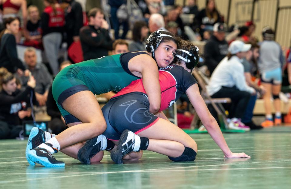 Jackson Memorial's Kamila Bieszczad (red) beats South Plainfield's Eva Altamirano (green) in the 132 weight class final at the 2022 East Brunswick Lady Bear Invitational Tournament on Dec. 30 at the Churchill Junior High School gymnasium in East Brunswick.