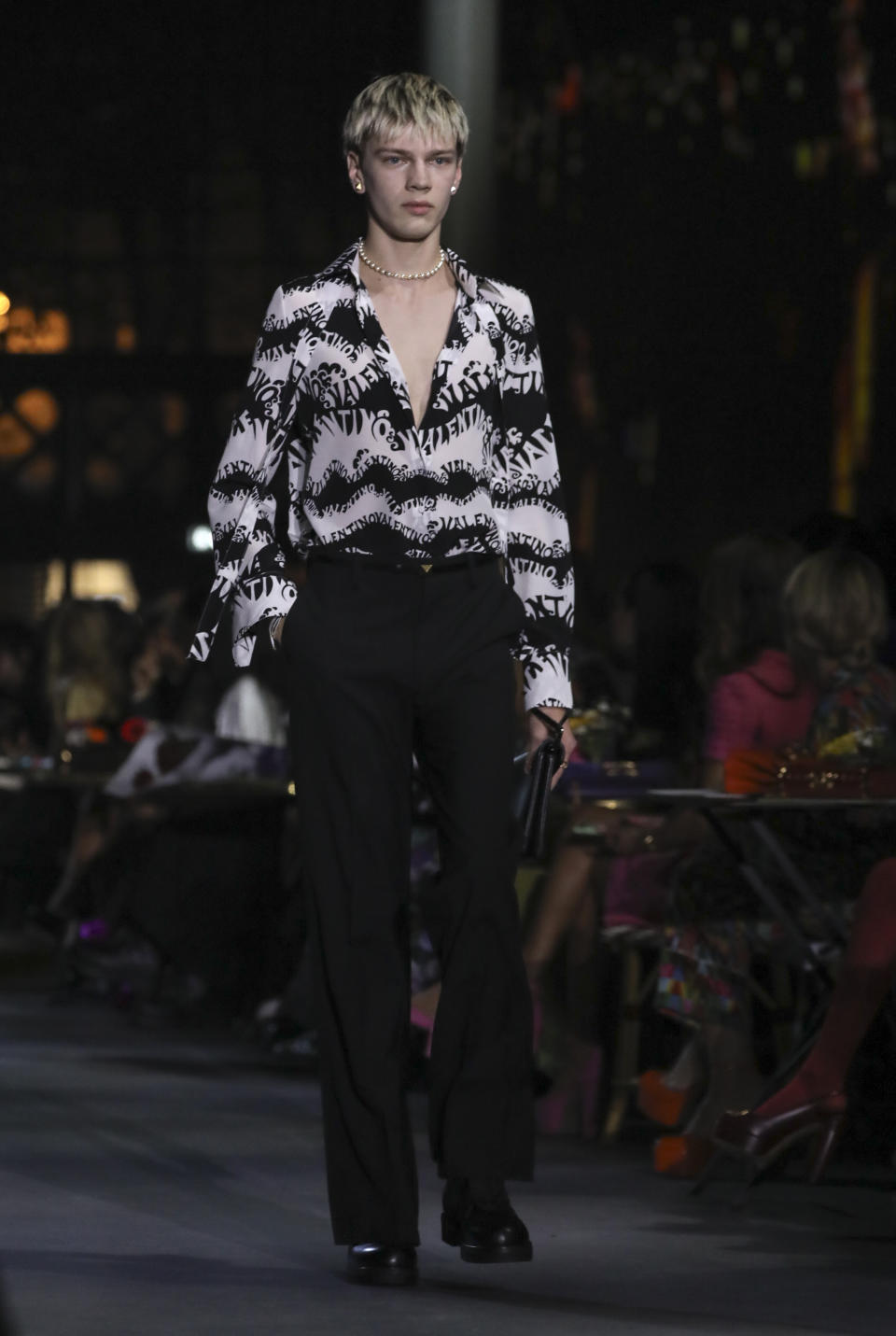 A model wears a creation for the Valentino Spring-Summer 2022 ready-to-wear fashion show presented in Paris, Friday, Oct. 1, 2021. (Photo by Vianney Le Caer/Invision/AP)