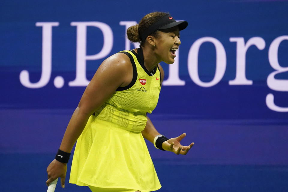 Naomi Osaka, of Japan, reacts during a match against Leylah Fernandez, of Canada, at the third round of the US Open tennis championships, Friday, Sept. 3, 2021, in New York. (AP Photo/John Minchillo)