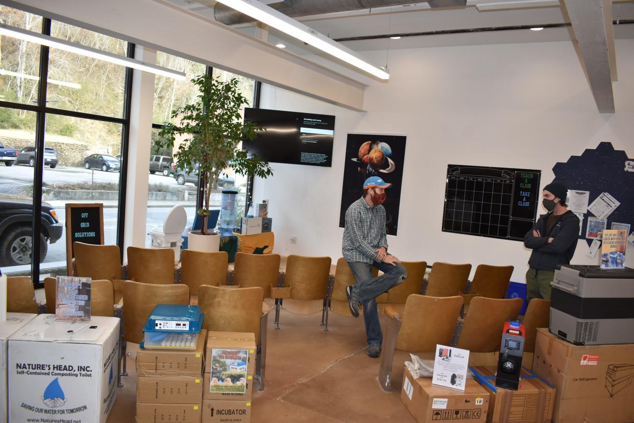 Jeff Flake, owner of Van Life Conversions in Marshall, speaks with a customer at Off Grid Store Jan. 12.