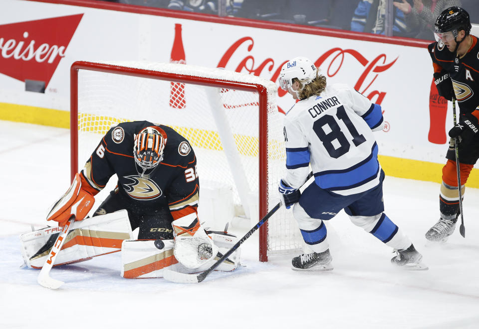 Anaheim Ducks goaltender John Gibson (36) saves a shot by Winnipeg Jets' Kyle Connor (81) during second-period NHL hockey game action in Winnipeg, Manitoba, Thursday, Nov. 17, 2022. (John Woods/The Canadian Press via AP)