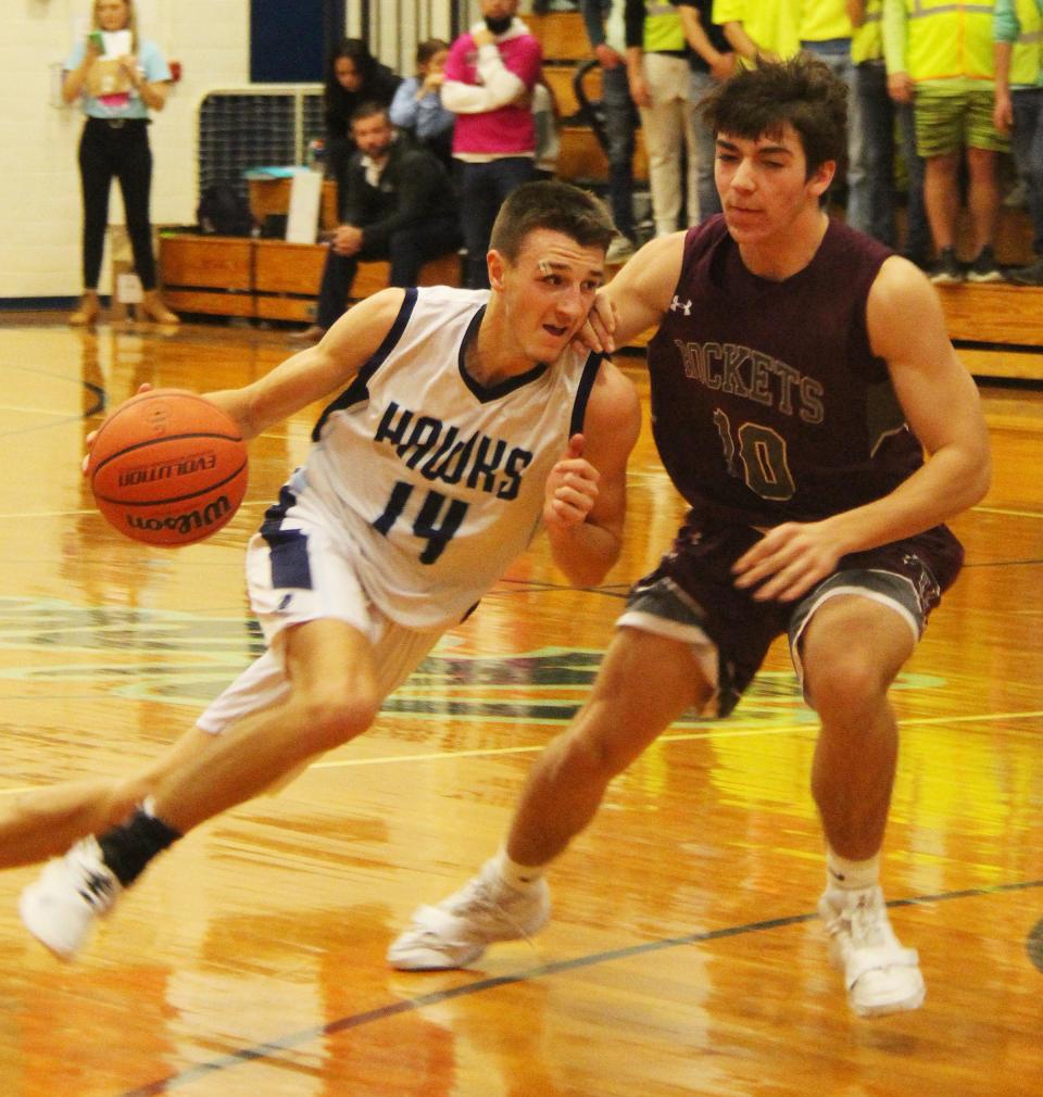 Dylan Bazzell of Prairie Central drives against Eric Miebach of Tolono during their Illini Prairie Conference basketball game Friday. Bazzell scored 16 points to help lead the Hawks to their 20th win of the season.