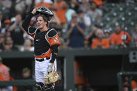 Baltimore Orioles' Adley Rutschman takes the field for his major league debut, against the Tampa Bay Rays in a baseball game Saturday, May 21, 2022, in Baltimore. (AP Photo/Gail Burton)