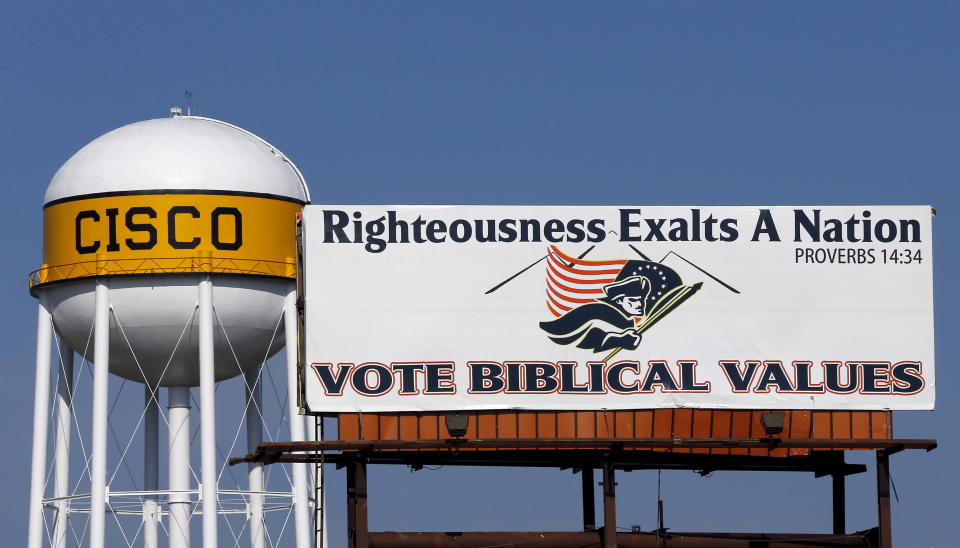 A billboard next to a Cisco, Texas, water tower reads: Righteousness exalts a nation. Vote biblical values.