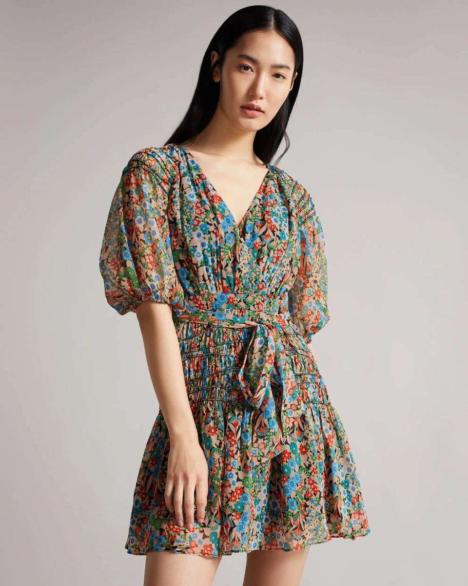 <p>The print on this <span>Ted Baker Tiania Smock Panel Wrap Mini Dress</span> ($177, originally $295) is gorgeous. Ted Baker is marking down some customer favorites up to 40 percent off this weekend.</p>
