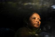 A migrant is seen in a bus near Frontera Hidalgo