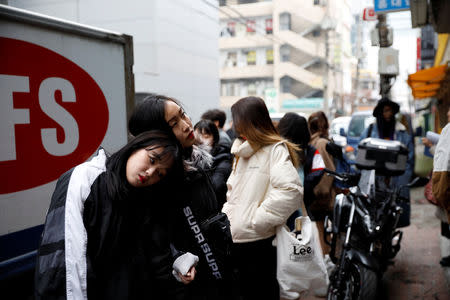 Japanese Yuuka Hasumi, 17, and Ibuki Ito, 17, also from Japan, who want to become K-pop stars, spend time before taking part in an audition in Seoul, South Korea, March 16, 2019. REUTERS/Kim Hong-Ji