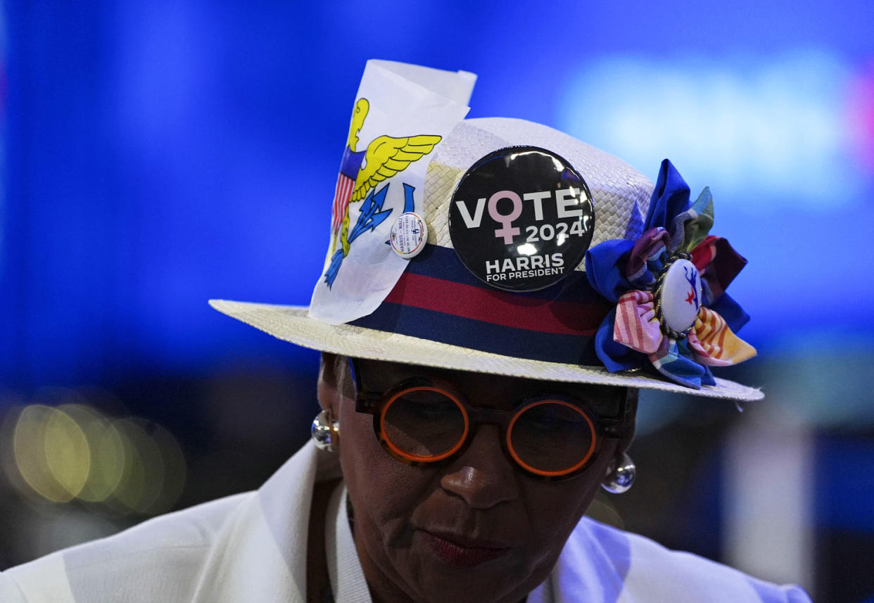 Democratic National Convention attendee wears a hat with buttons in support of Kamala Harris (Demetrius Freeman / The Washington Post via Getty Images)