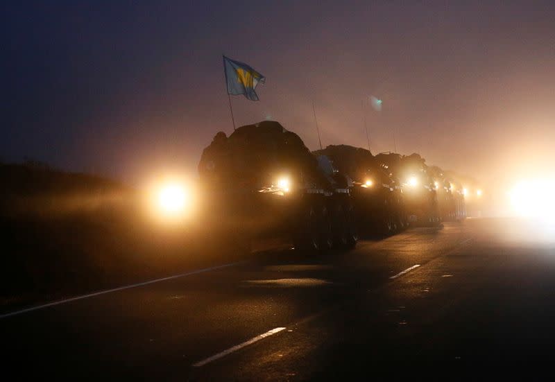 Military vehicles of the Russian peacekeeping forces are seen on a road near Goris