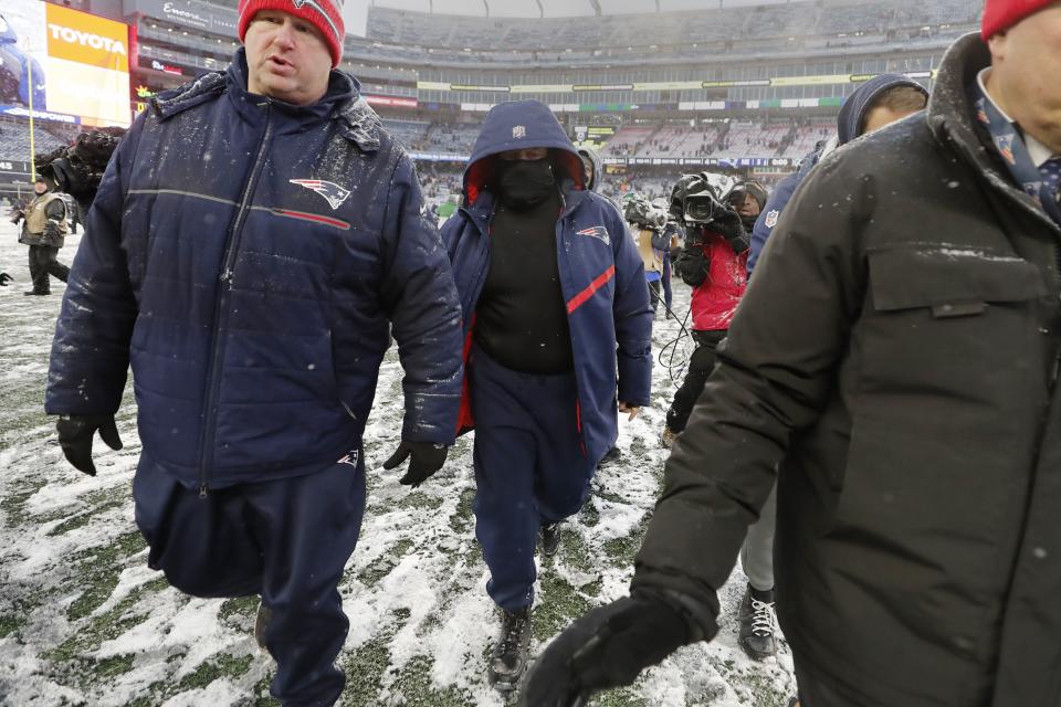New England Patriots head coach Bill Belichick, center, walks off the field after an NFL football game, Sunday, Jan. 7, 2024, in Foxborough, Mass. The Jets defeated the Patriots 17-3. (AP Photo/Michael Dwyer)