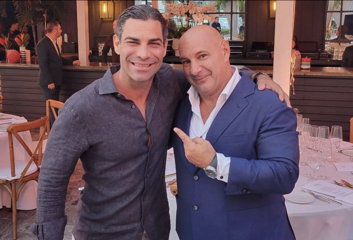 Francis Suarez poses with Venanzio Ciampa, a partner at the Gr8 Experience hospitality group, at their $6,000 per-person pop-up event during Formula One weekend.