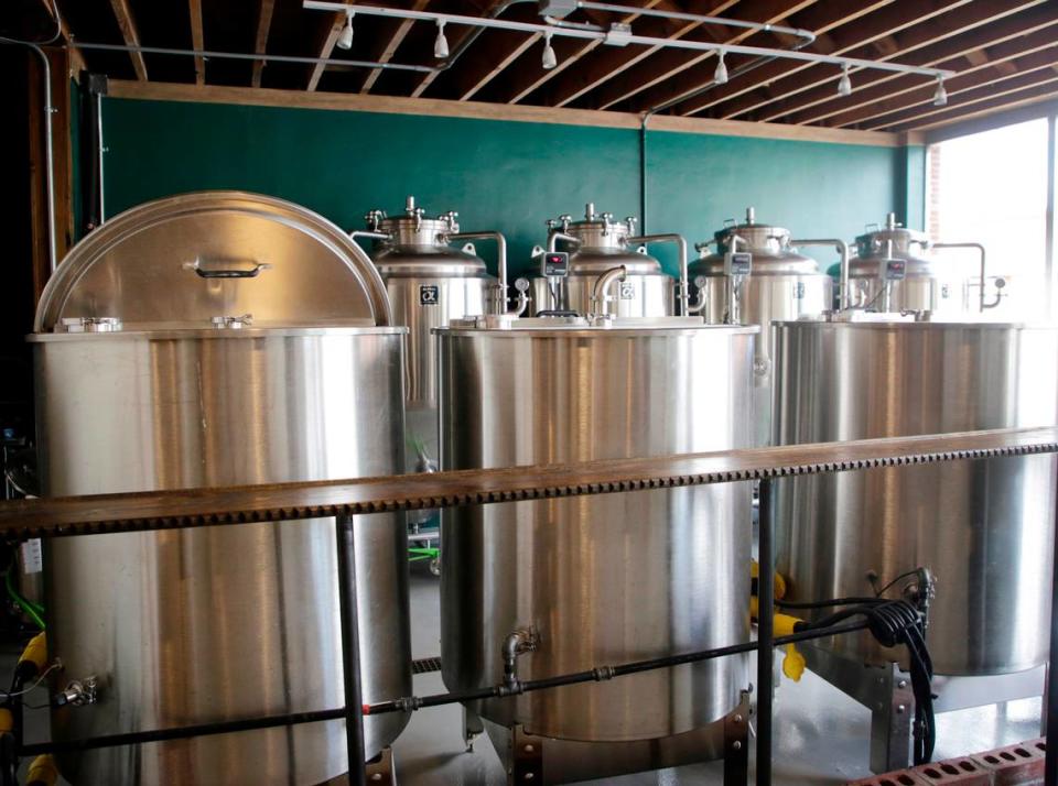 The inner workings of Working Theory Beer Co. are seen from a window fronting East Liberty Street in downtown York.