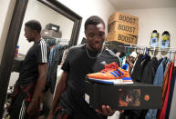 American track and field sprinter Noah Lyles shows off one of his favorite pairs of shoes in the closet of his home after training at the National Training Center in Clermont, Florida, U.S., February 19, 2019. Photo taken February 19, 2019. REUTERS/Phelan Ebenhack