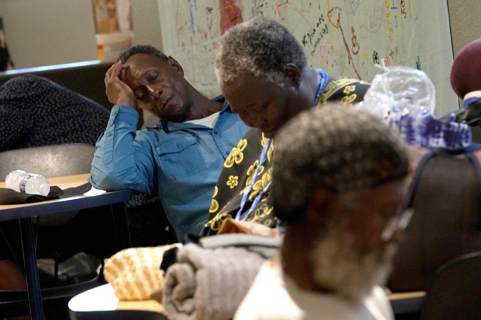 During the July 2023 heat wave, people gathered at the Justa Center, a day cooling center in downtown Phoenix for people age 55 and older who are homeless. <a href="https://newsroom.ap.org/detail/PhoenixLeavingtheHeat/18a7e05d8150417cb82ce50c852d9eb1/photo" rel="nofollow noopener" target="_blank" data-ylk="slk:AP Photo/Matt York;elm:context_link;itc:0;sec:content-canvas" class="link ">AP Photo/Matt York</a>