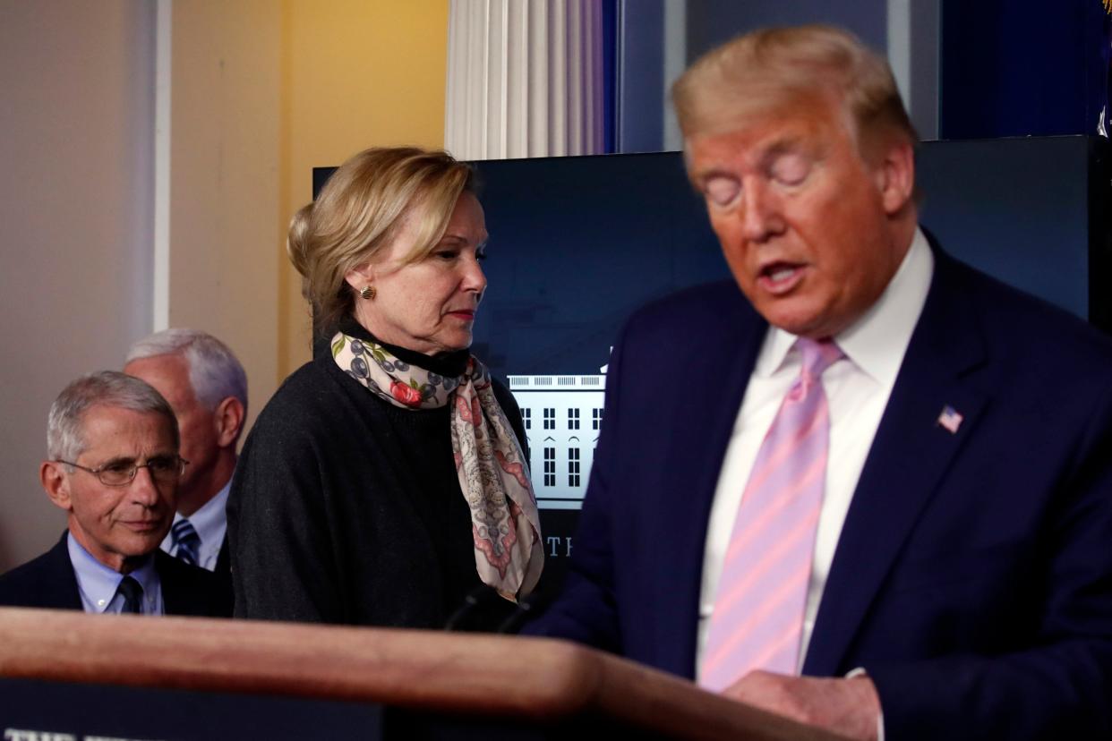 Donald Trump speaks at a White House coronavirus briefing as Deborah Birx and Anthony Fauci step on to the stage behind him: AP