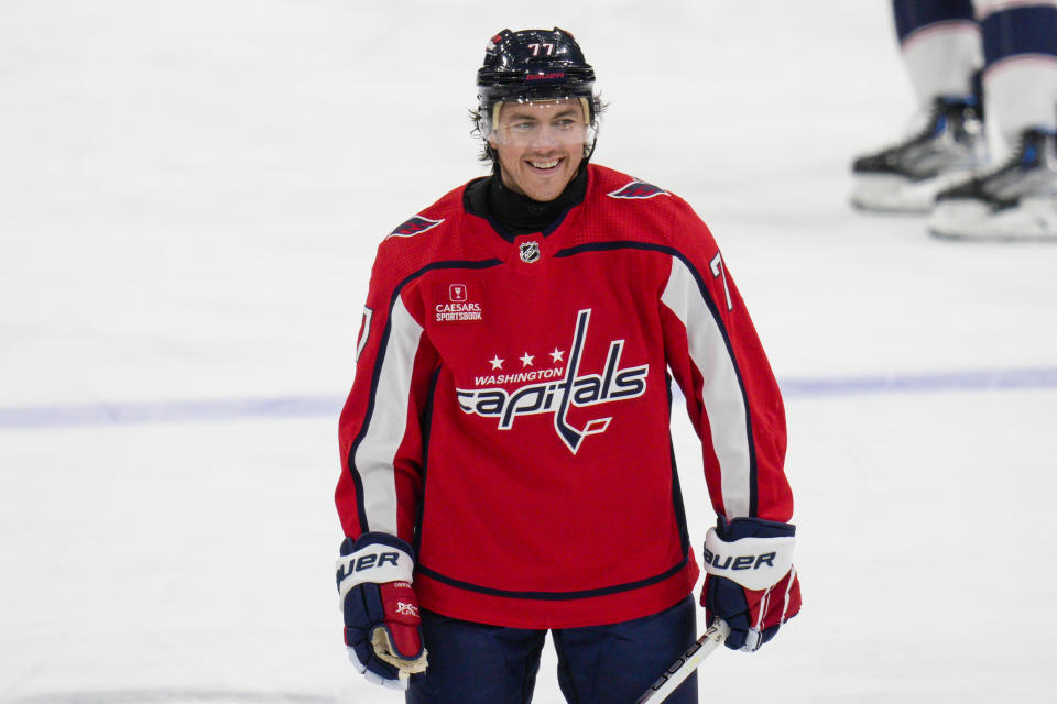 FILE - Washington Capitals right wing T.J. Oshie wears a neck guard, made by his company, Warroad Hockey, as he warms up before an NHL hockey game against the Columbus Blue Jackets, Saturday, Nov. 4, 2023, in Washington. The death of American hockey player Adam Johnson from a skate cut to the neck during a game in England has led to plenty of talk about how to prevent such injuries in the fast-paced sport, including a new neck laceration protection mandate in the U.S. It has also spurred companies to race to produce technology that improves safety and reduces the on-ice risk and frequency of cuts from skate blades. (AP Photo/Jess Rapfogel, File)