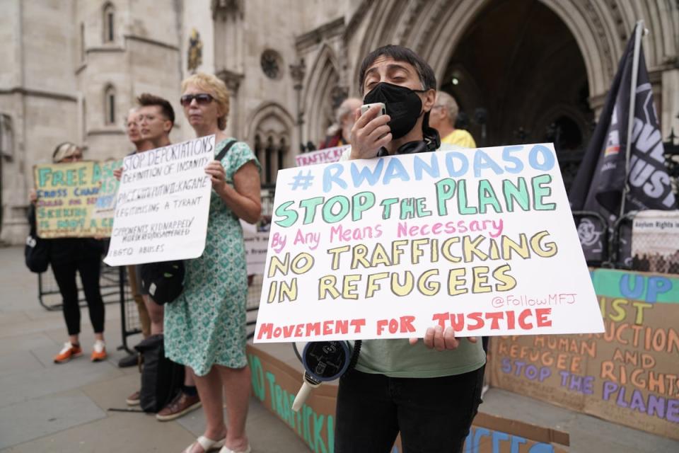 Protesters outside the High Court in London on June 13. The first deportation flight – due to take off the next day – was grounded amid a series of legal challenges (Aaron Chown/PA) (PA Wire)