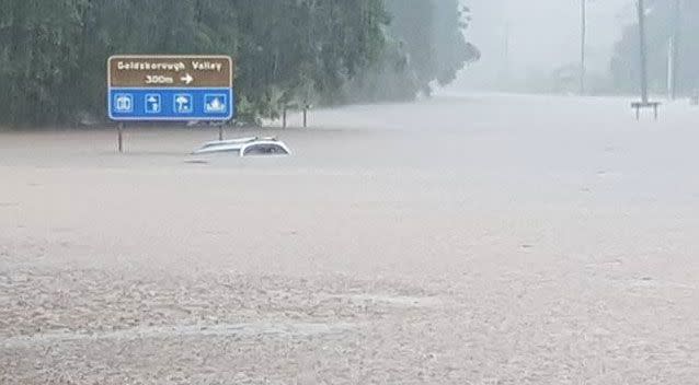 An elderly man drove into Cairns floodwaters on Thursday and became trapped. Photo: Facebook/ Sam Greenwood