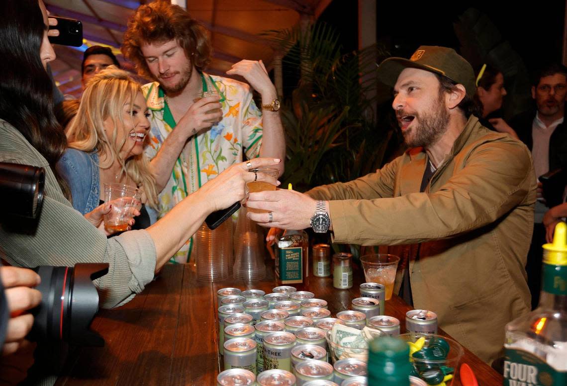 Charlie Day of “It’s Always Sunny in Philadelphia” serves up drinks at the Four Walls Irish American Whiskey booth during Burger Bash at the South Beach Wine & Food Festival on Miami Beach.