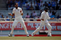 Cricket - India v Australia - Third Test cricket match - Jharkhand State Cricket Association Stadium, Ranchi, India - 20/03/17 - India's Ishant Sharma and Murali Vijay (R) celebrate the dismissal of Australia's Matt Renshaw. REUTERS/Adnan Abidi