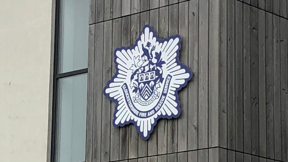 Gloucestershire Fire and Rescue logo outside the building